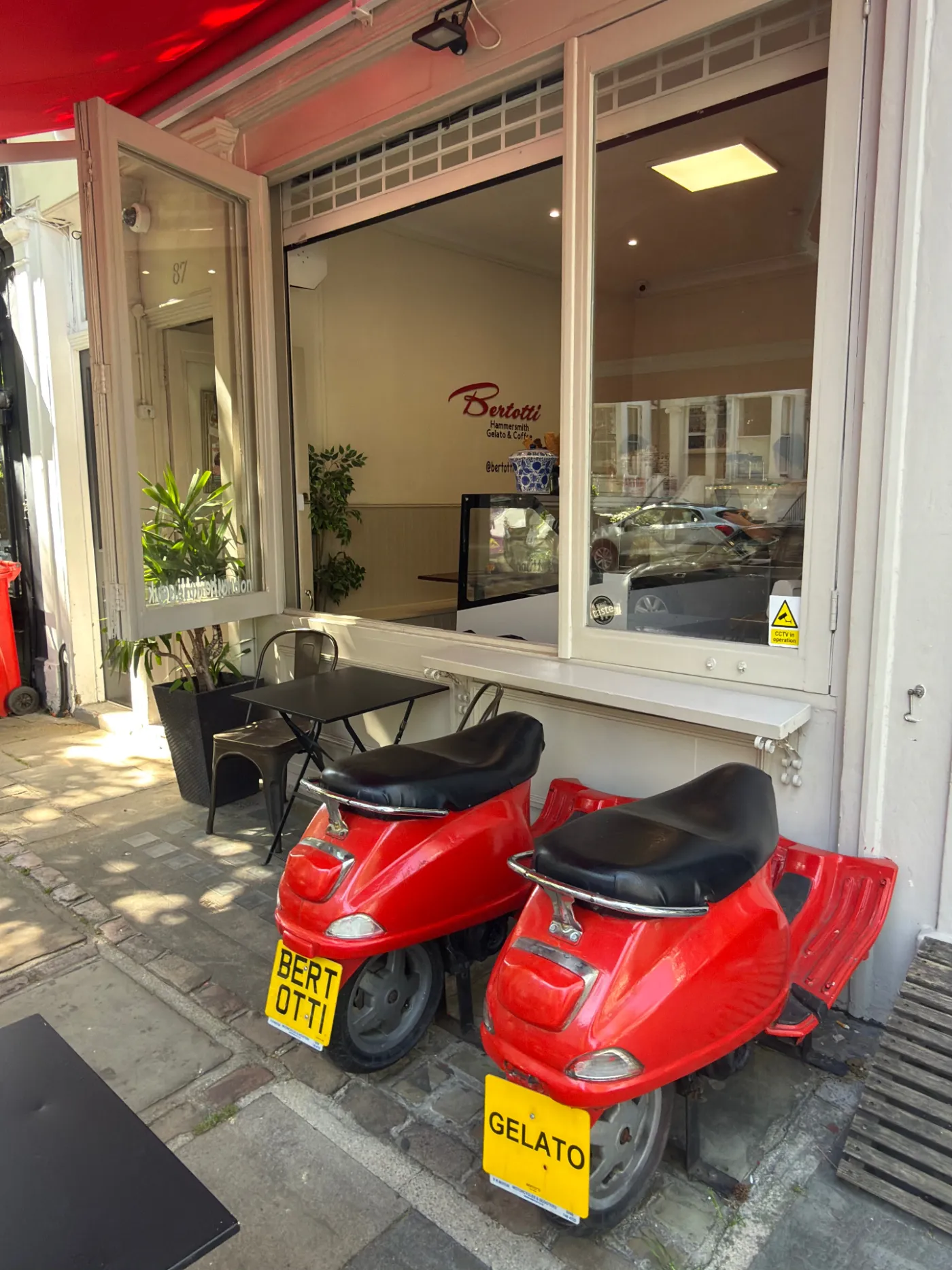 Bertotti Gelato storefront with branded Piaggio scooters on Hammersmith Grove